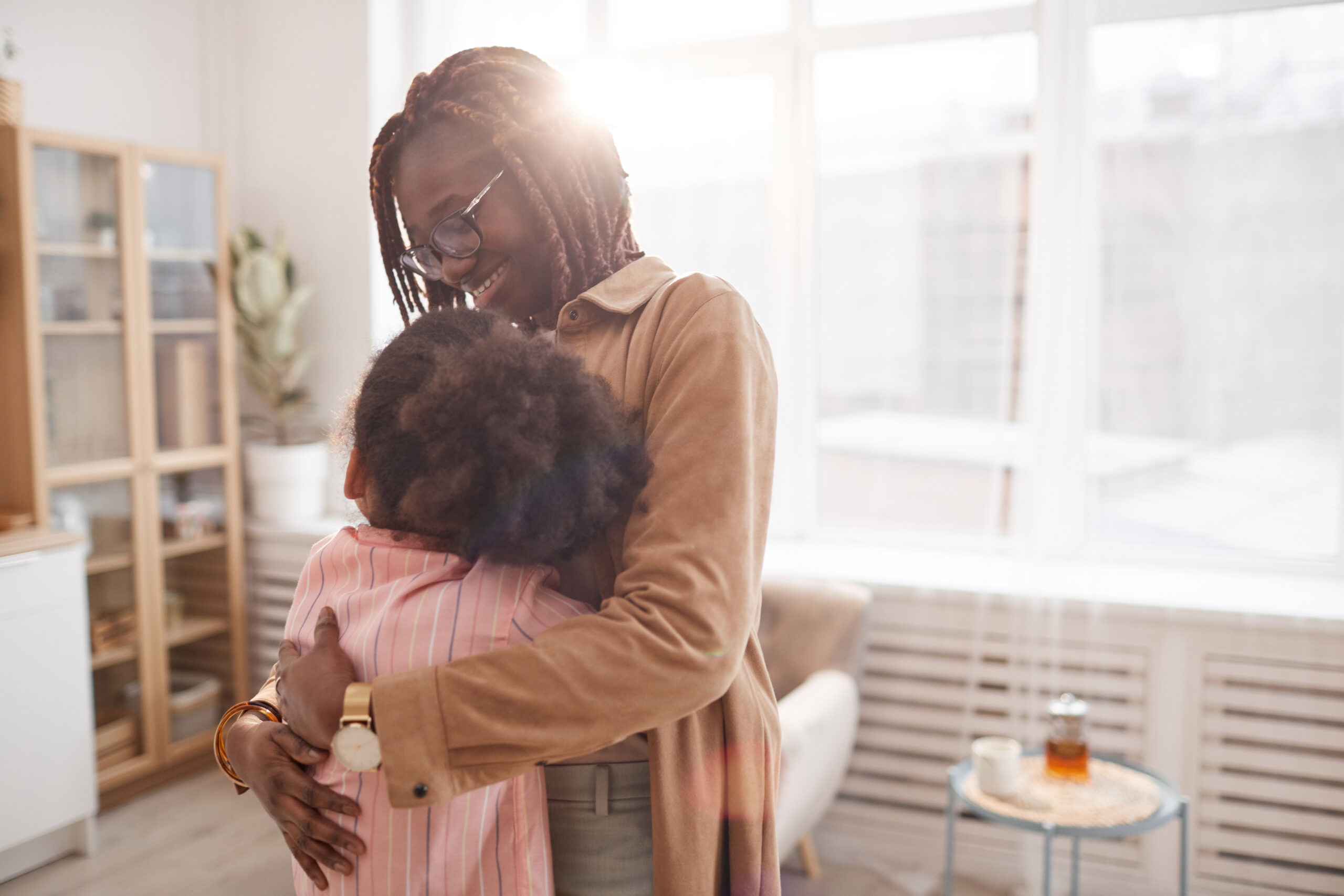 Mother and child inside a peaceful, welcoming home environment