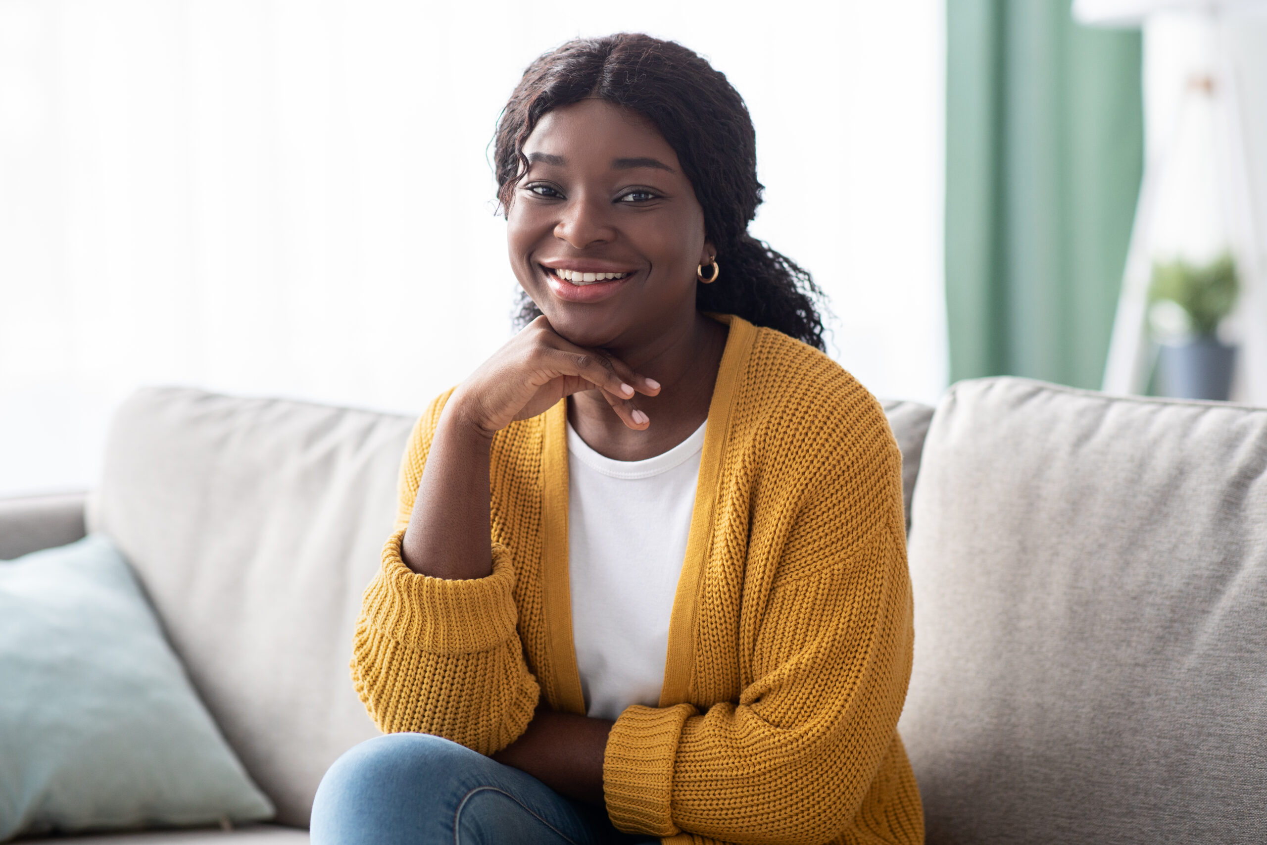 Woman smiling warmly — relaxed and approachable, ready to connect