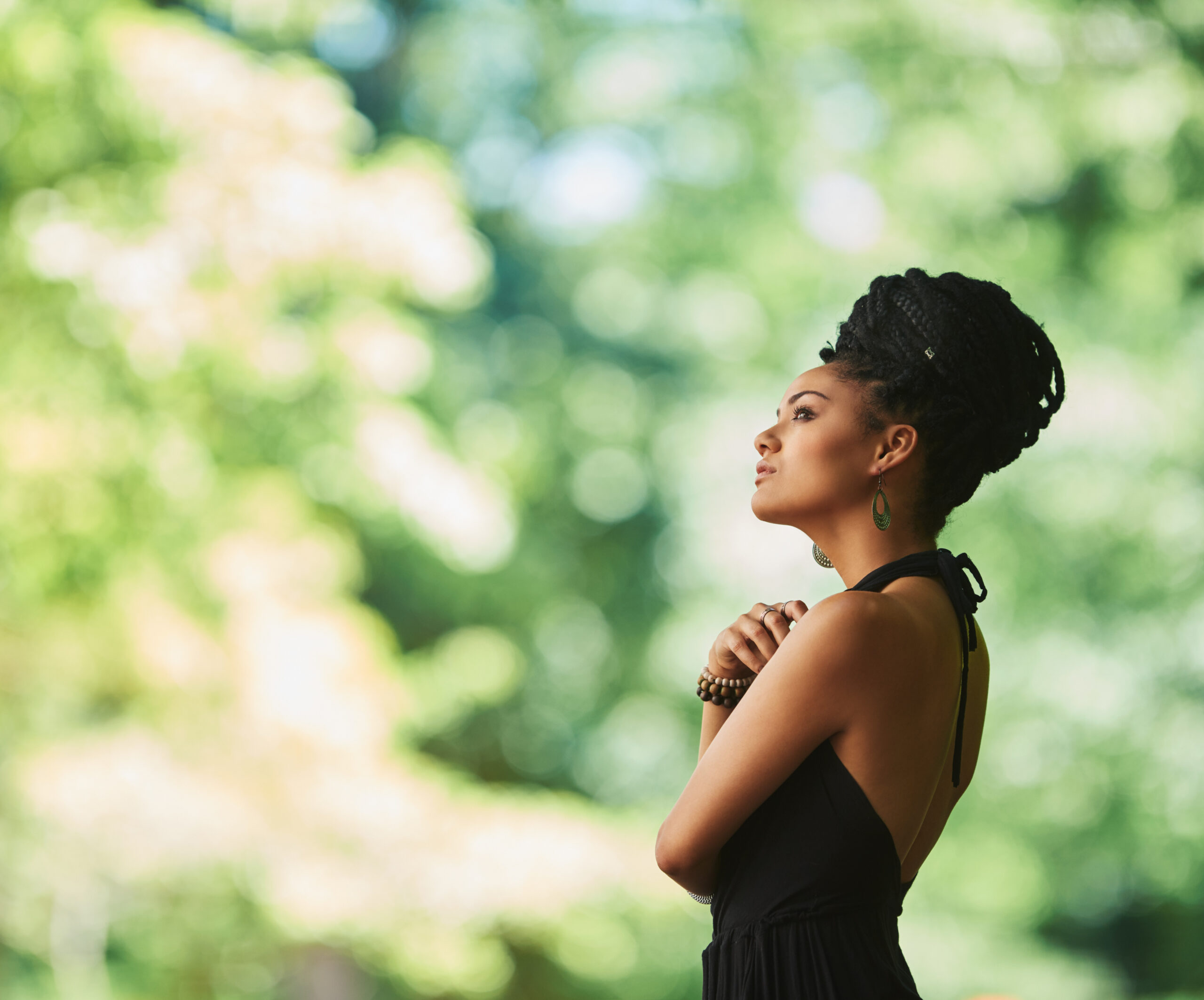 Woman smiling softly in a calm environment, showing quiet confidence and emotional relief