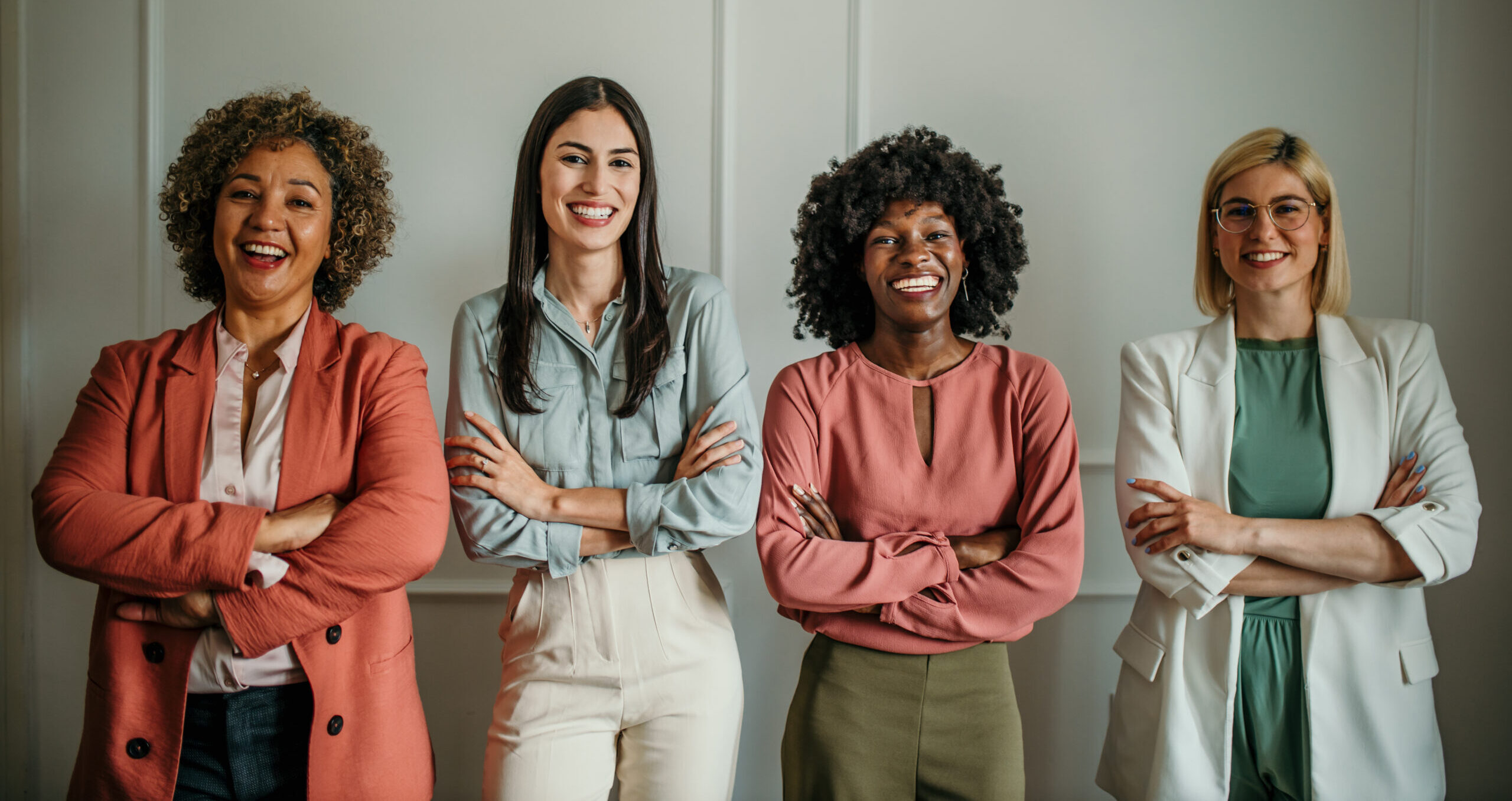 Professional women in a warm, welcoming setting — confident and approachable