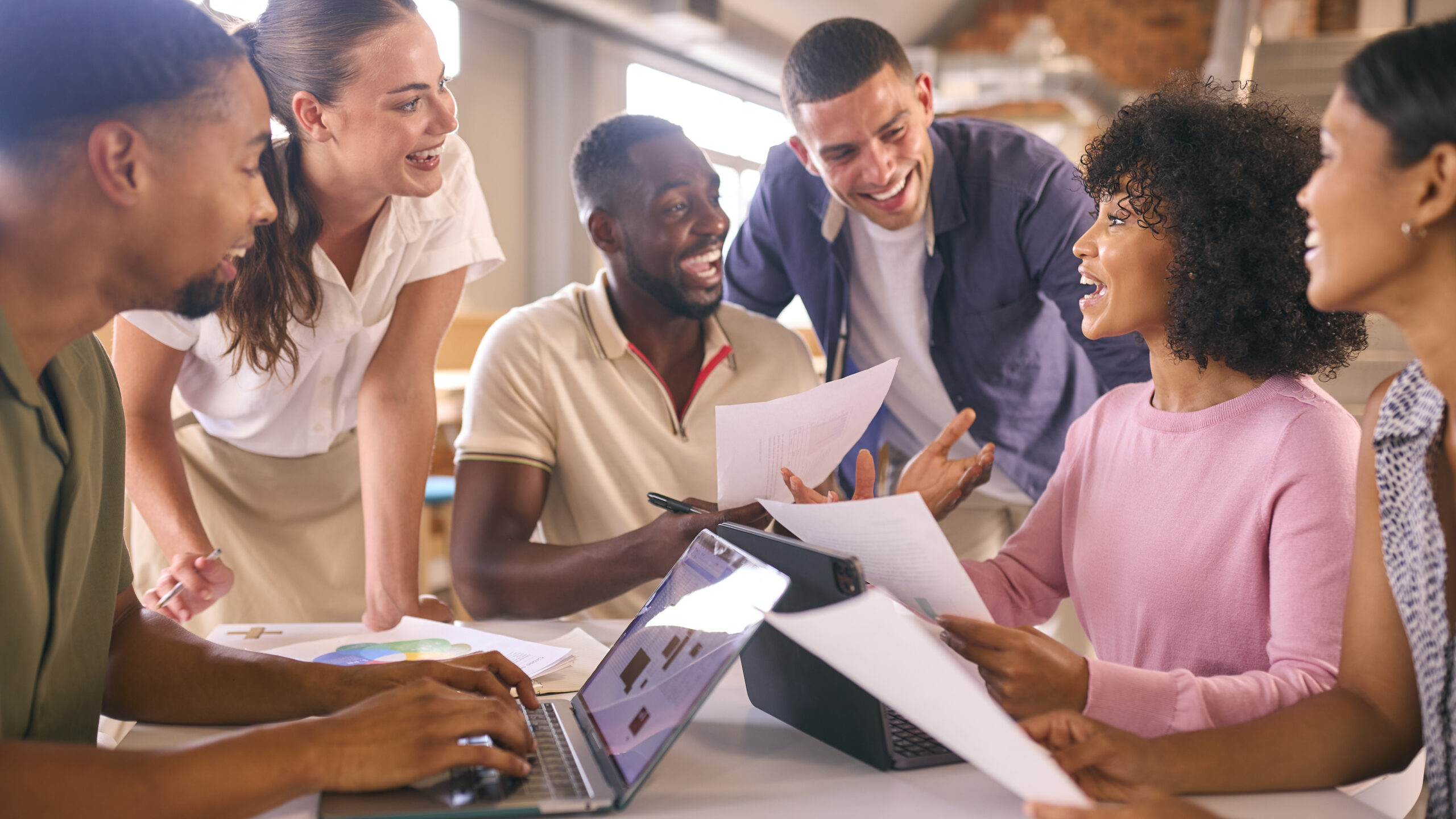 Professional partnership meeting — diverse group collaborating with purpose