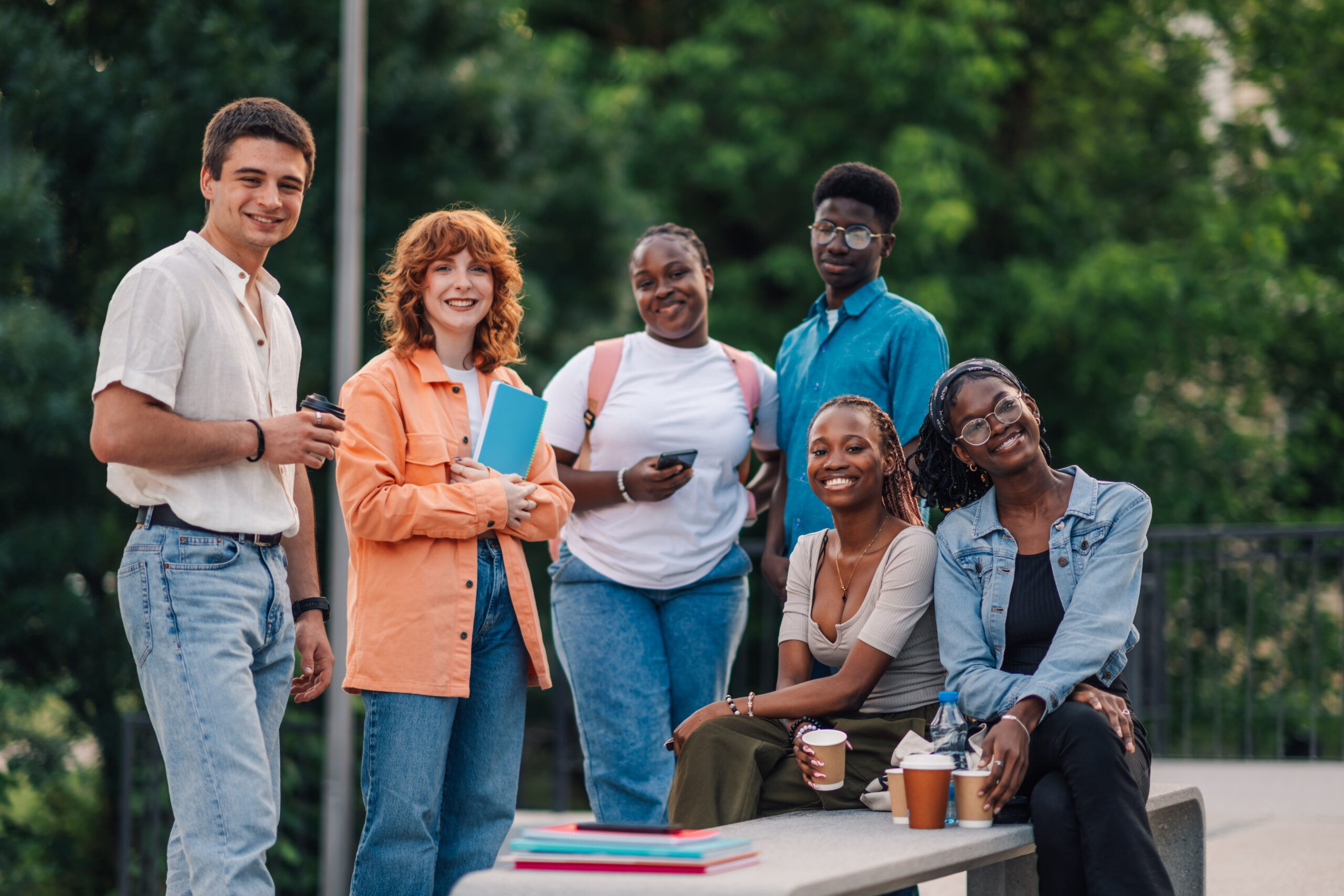 Diverse group of people working together at a community event, smiling and collaborative