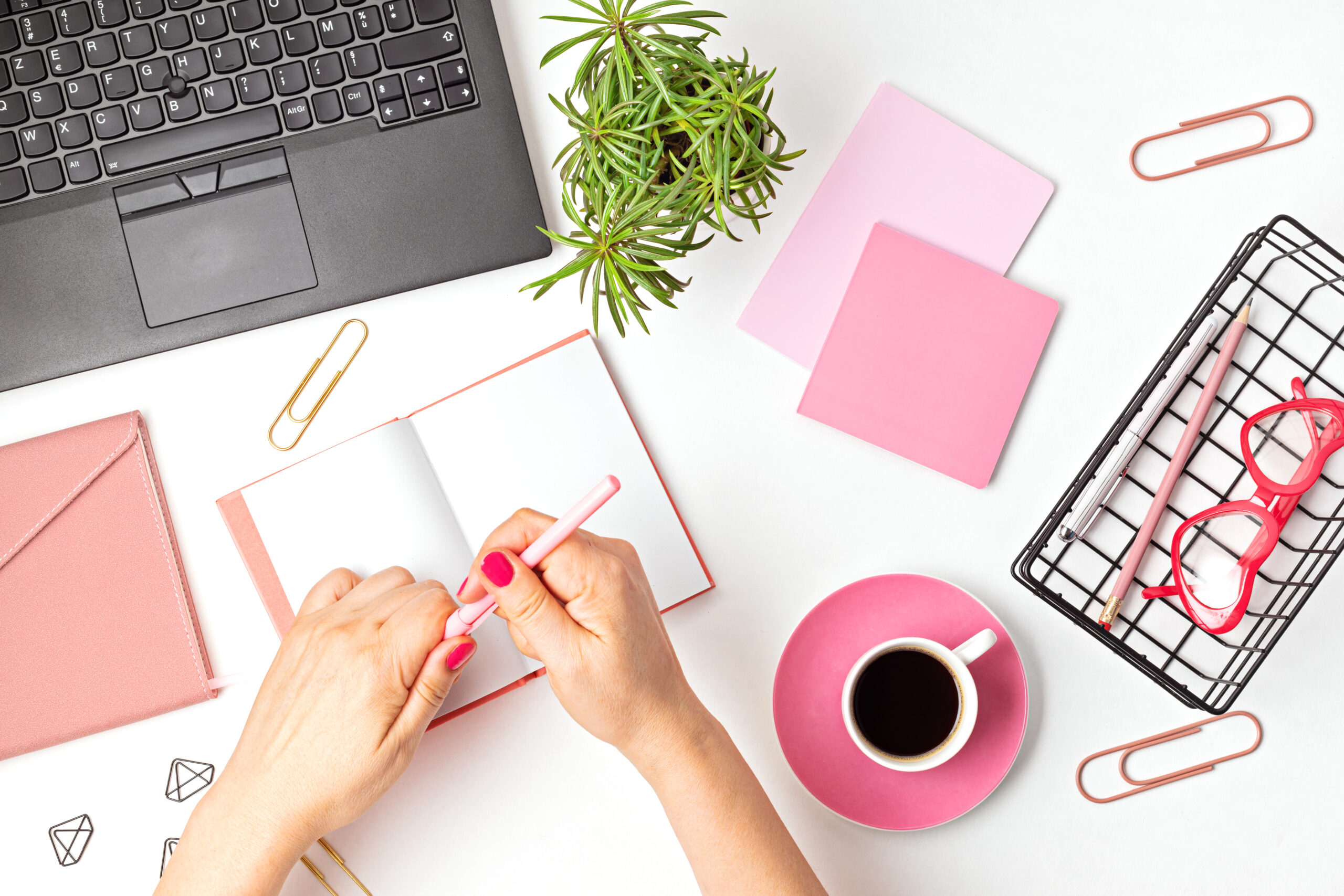 Organized desk with documents, laptop, and notebook — professional and intentional