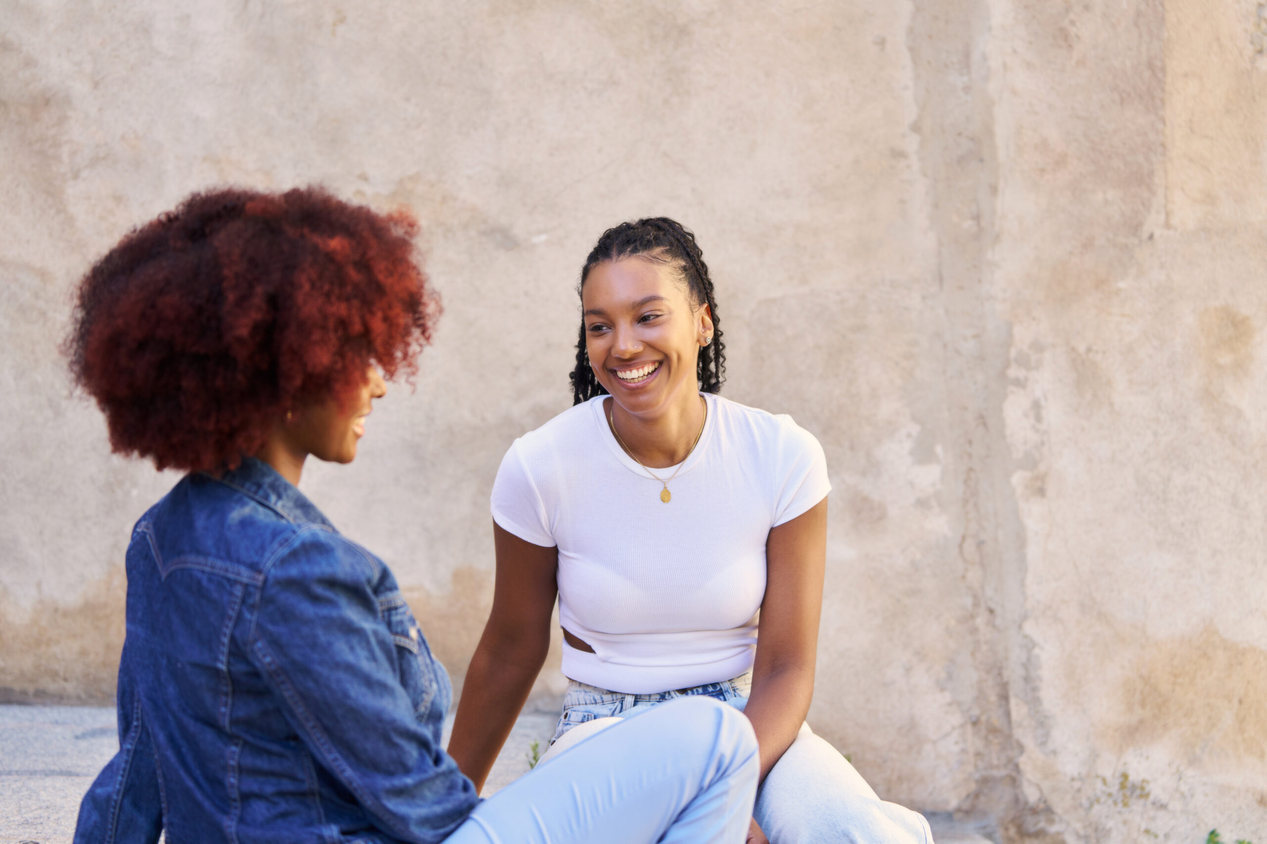 Two women in a warm, trusting conversation — support and connection