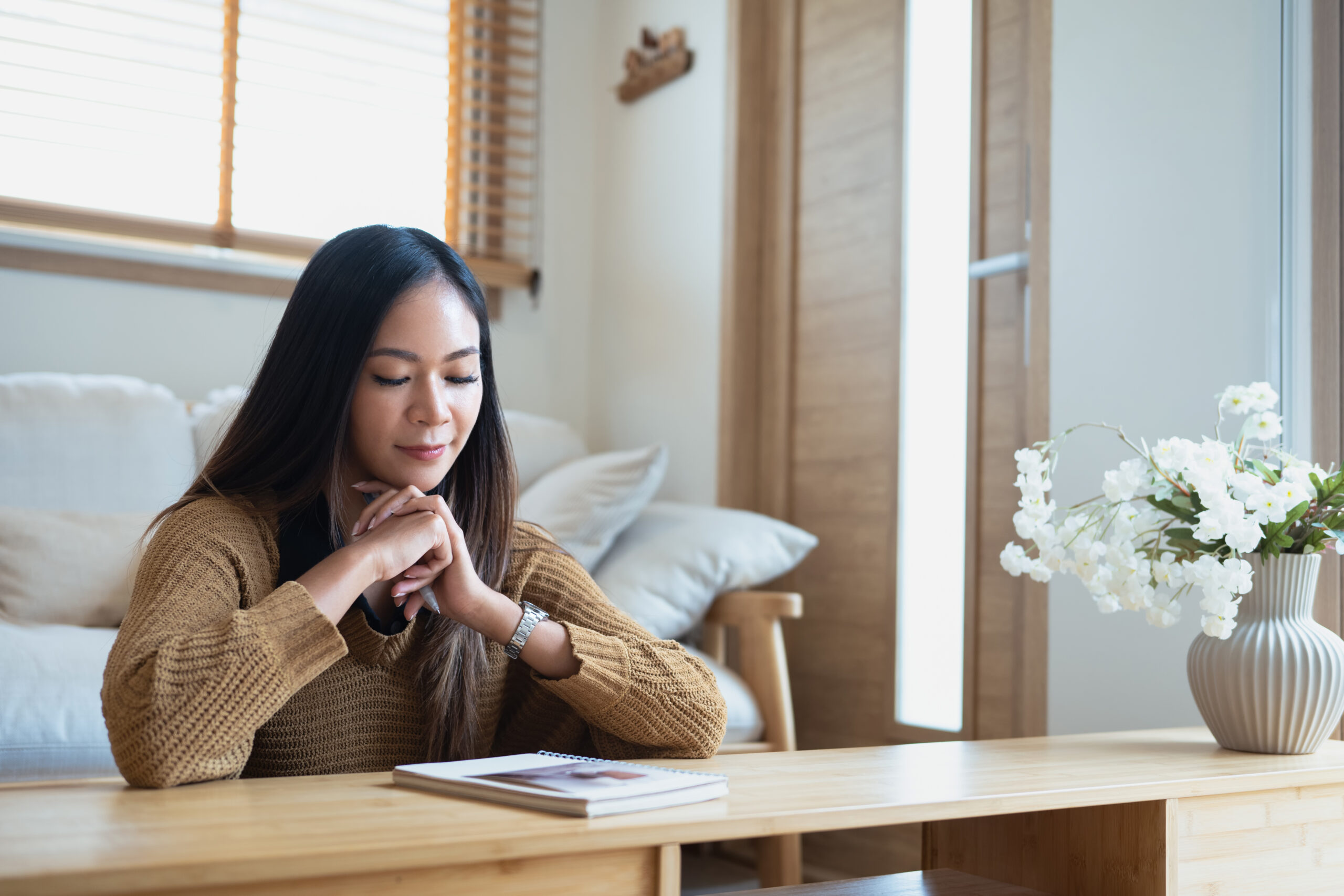 Woman in a quiet, calm moment of reflection and thoughtful preparation
