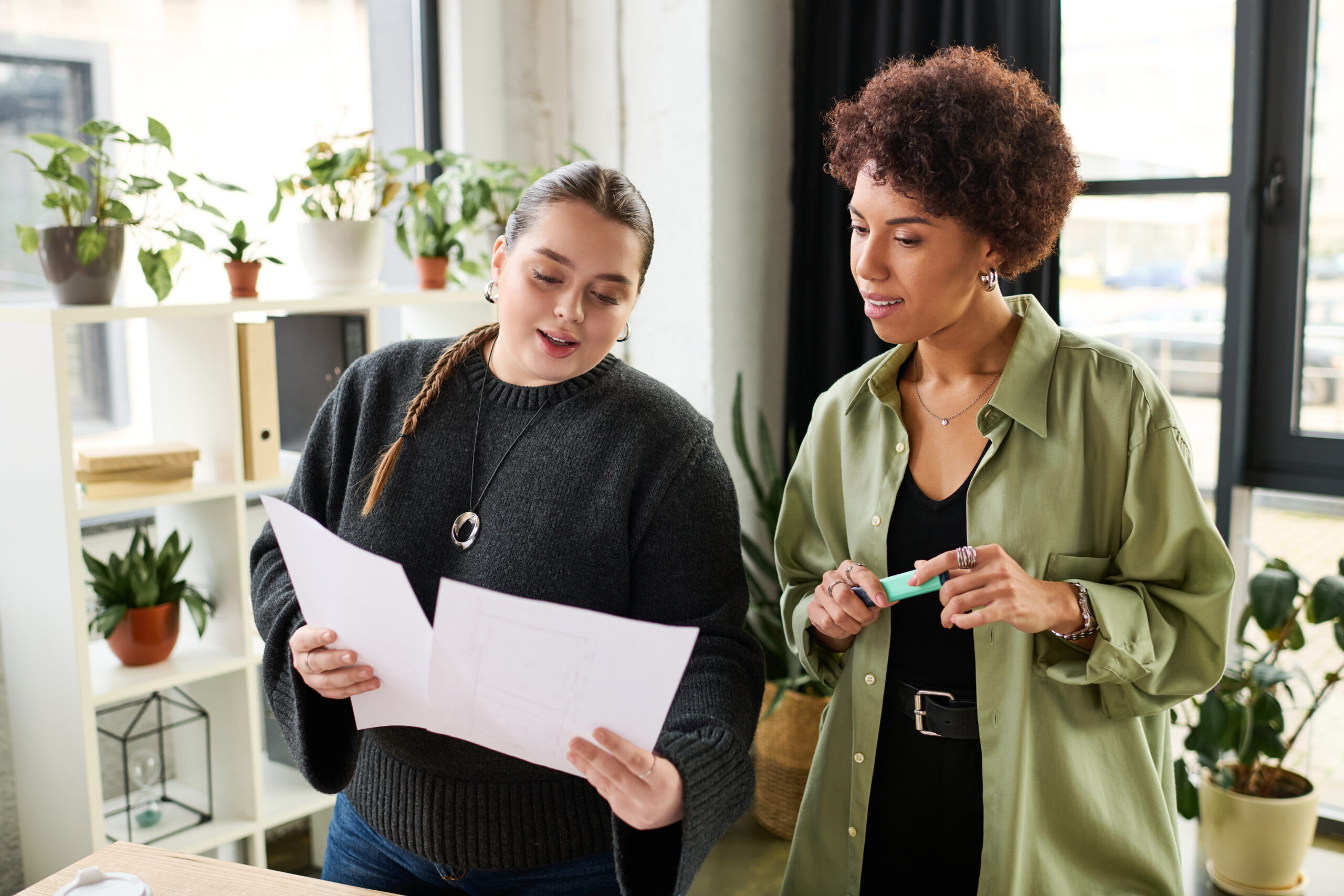 Two women reviewing documents together in a calm, supportive environment